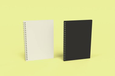 Sarı arka plan üzerinde iki defter spiral ile bağlı