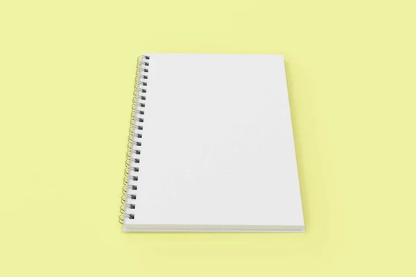 Abrir espiral notebook encadernado no fundo amarelo — Fotografia de Stock