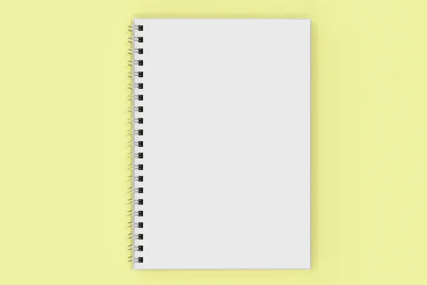 Opend anteckningsbok spiral bunden på gul bakgrund — Stockfoto