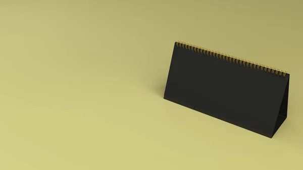 Mock-up de calendário de mesa preta na superfície amarela — Fotografia de Stock