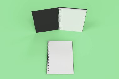 Yeşil arka plan üzerinde iki defter spiral ile bağlı