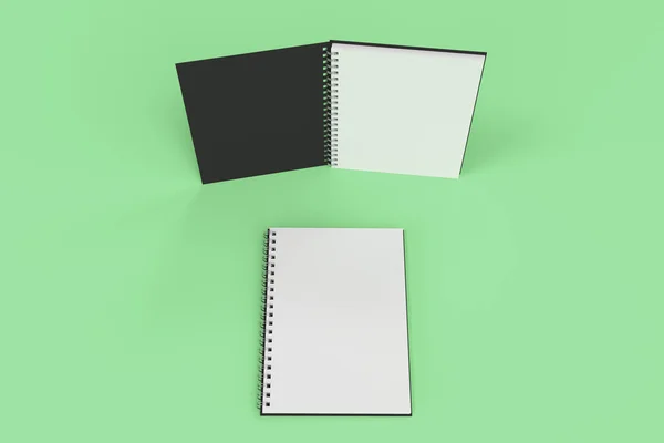 Dos cuadernos con espiral encuadernada sobre fondo verde — Foto de Stock