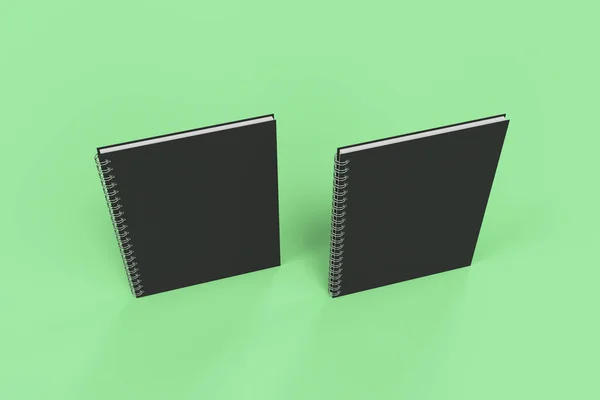 Dos cuadernos con espiral encuadernada sobre fondo verde — Foto de Stock