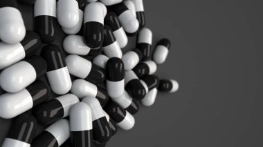 Siyah ve beyaz ilaç kapsül yığını