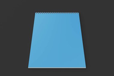 Boş mavi defter ile metal sarmal siyah arka plan üzerine bağlı