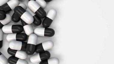 Siyah ve beyaz ilaç kapsül yığını