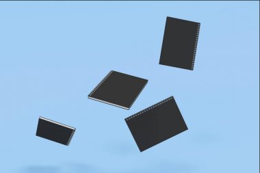 Dört defter spiral ile mavi arka plan üzerinde bağlı