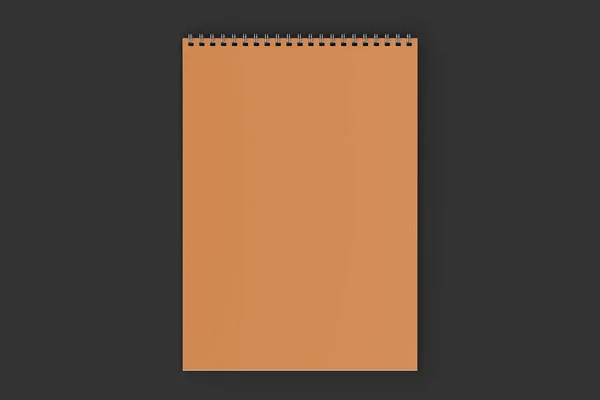 Порожній помаранчевий блокнот з металевою спіраллю, прив'язаною на чорному фоні — стокове фото