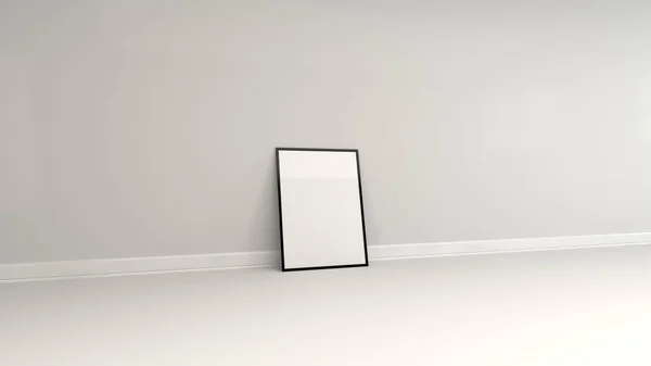 Affiche blanche vierge dans un cadre noir debout sur le sol — Photo