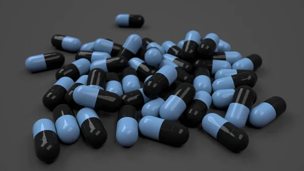 Pila de cápsulas de medicamentos negros y azules — Foto de Stock
