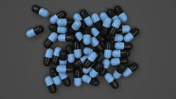 Pilha de cápsulas de medicina preto e azul — Fotografia de Stock