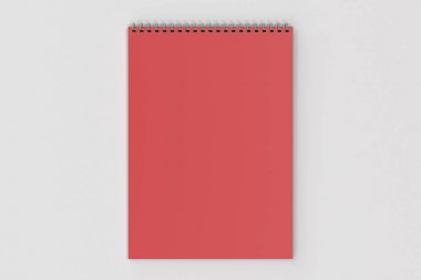 Beyaz arka plan üzerinde boş kırmızı defter metal spiral ile bağlı