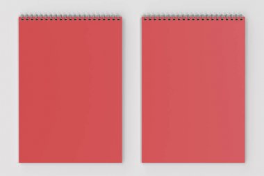 Beyaz arka plan üzerinde boş kırmızı defter metal spiral ile bağlı