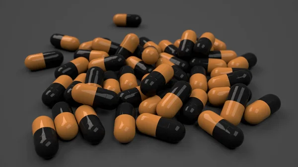 Pile of black and orange medicine capsules