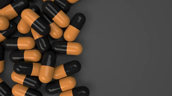Siyah ve turuncu ilaç kapsül yığını — Stok fotoğraf