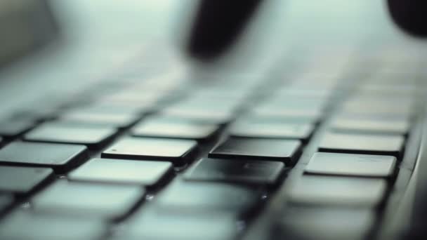 Man hands typing on a keyboard using his laptop computer — Stock Video