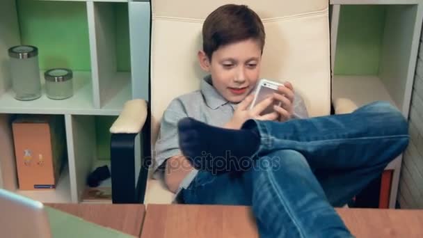 Happy little boy talking on the phone — Stock Video