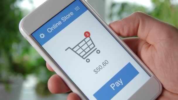 Оплата онлайн покупок с помощью приложения для смартфонов — стоковое видео