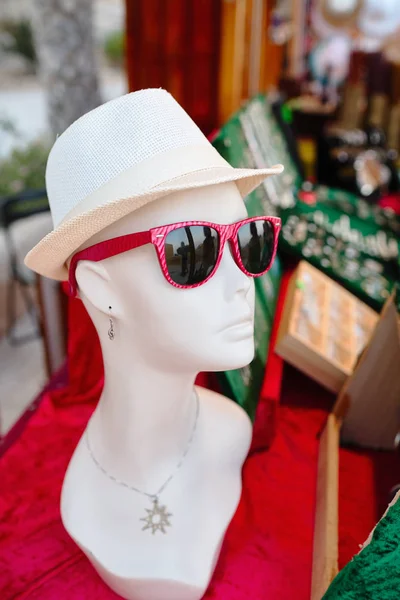 Mannequin woman with glasses and hat