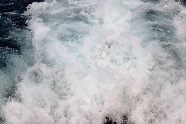 Trail on water surface behind of cruise ship — Stock Photo, Image