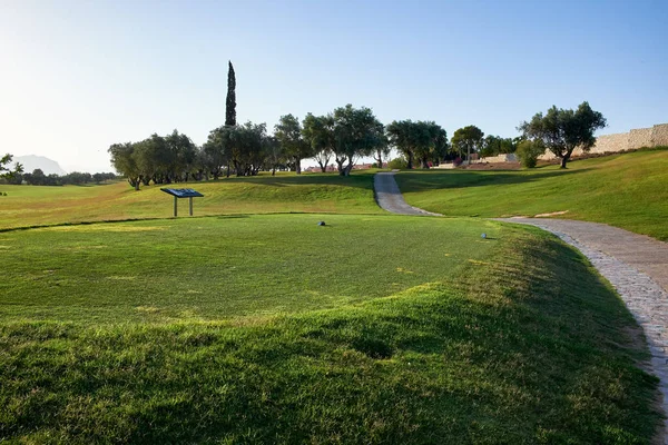 Golf course with gorgeous green and pond. Algorfa, Spain.