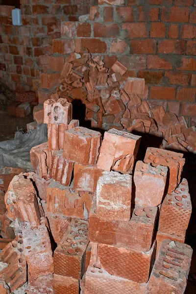 Pile of Bricks by an Old Brick Wall taken by an old building in St. Petersburg.