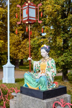 Statue on Chinese Grand Bridge 1785, it is reconstructed in 1860 in Alexander Park, Tsarskoye Selo, Pushkin, Saint Petersburg, Russia. clipart