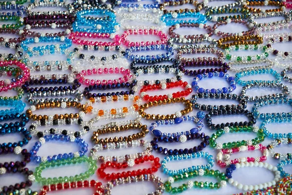 Beautiful beads from ornamental stone and colorful glass. Market, Mercadillo de Campo de Guardamar.