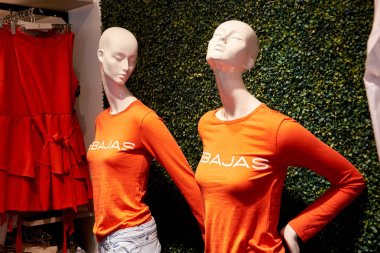 Two female dummies in clothes with the inscription: Sales. Orihuela, La Zenia. Spain clipart