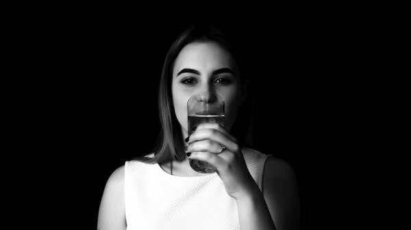 Young pretty woman drinks water Grayscale