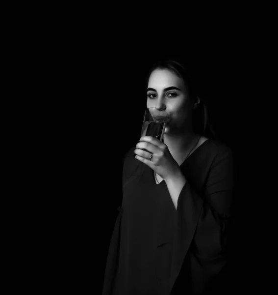 Young pretty woman drinks water Grayscale — Stock Photo, Image