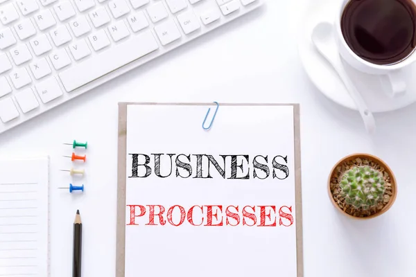 Text Business processes on white paper background / business concept