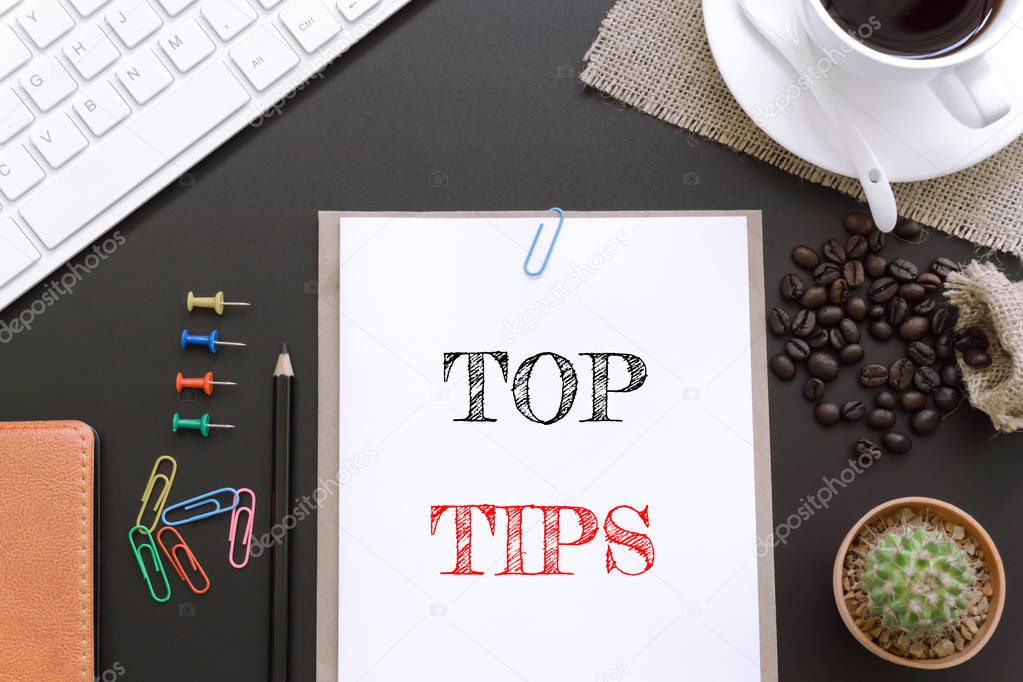 Text Top tips on white paper background / business concept.