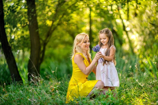 Girl together with mother play in the park — Stock Photo, Image