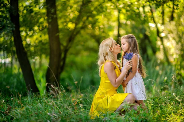 Girl together with mother play in the park — Stock Photo, Image