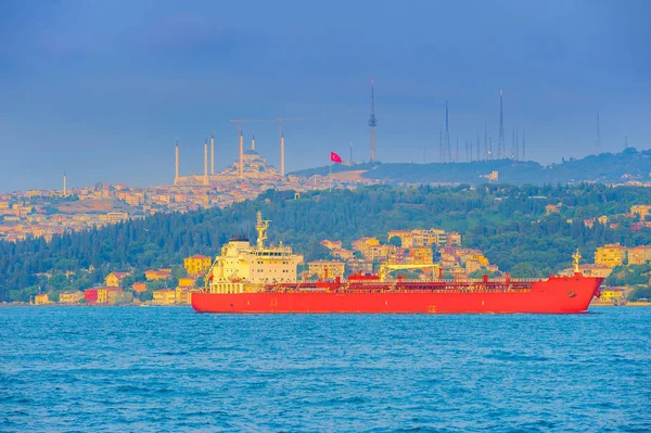 big ship passes through the Bosphorus strait, on a sunset, Istanbul