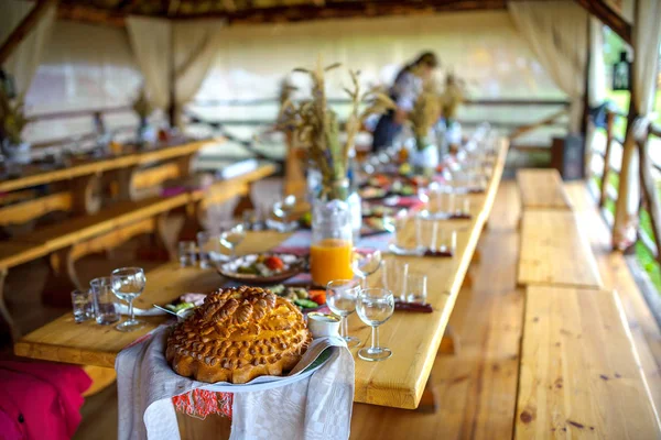 laid holiday table, in the forefront costs a loaf, a traditional feast