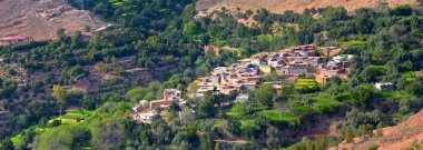 adobe village in the mountains of the Atlas of Morocco clipart