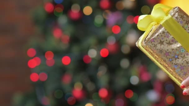 Mother Gives Gift Her Child Backdrop Bright Festive Lights Congratulations — Stock Video