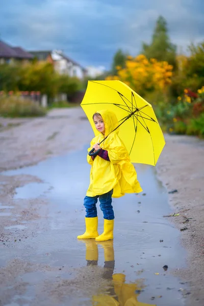 Cute Little Girl Raincoat Yellow Umbrella Her Hands Walks Puddles Stock Picture