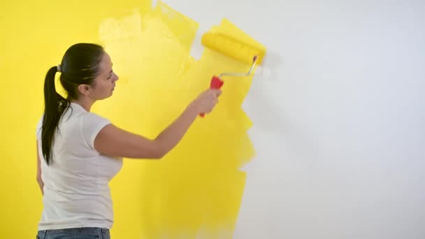 Girl Makes Repairs Room Woman Paints Wall Roller Yellow Repair — Stock Video