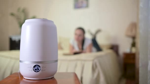 Steam Working Humidifier Air Ionization Room Blurred Background Girl Reading — Stock Video