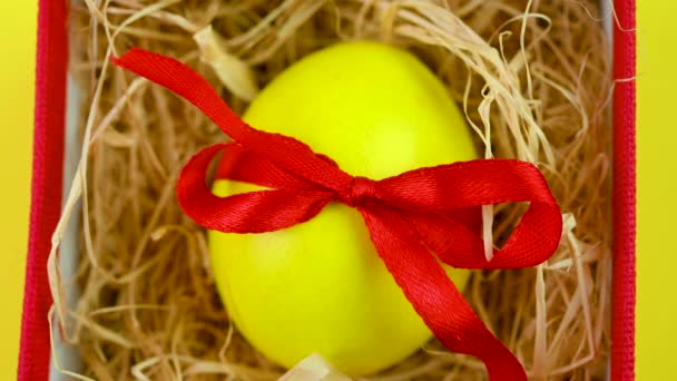 Colorful Easter Egg Decorated Red Ribbon Lies Small Gift Box — Stock video