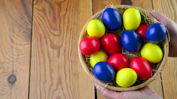 Easter Celebration Female Hands Hold Plate Colorful Easter Eggs Wooden — Stock video