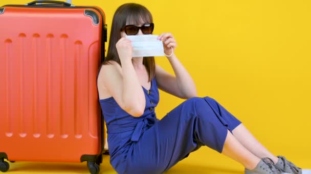 Young Girl Sunglasses Sits Suitcase Puts Medical Mask Torn Vacation — Stock Video