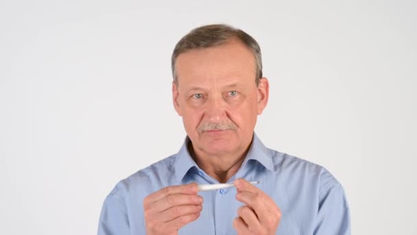 Elderly Man Measures Temperature Thermometer Isolated White Background Health Care — Stock Video