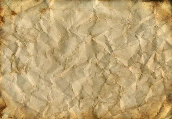 Crumpled paper background texture. Brown colors with burned edge — Stock Photo, Image