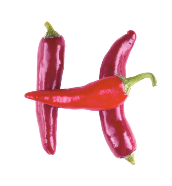 Levél H fehér alapon piros chili paprika — Stock Fotó