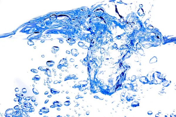 Blue lit water splash with wave and bubbles — Stock Photo, Image