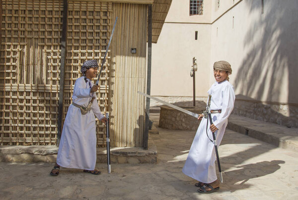 Young omani boy with a sword